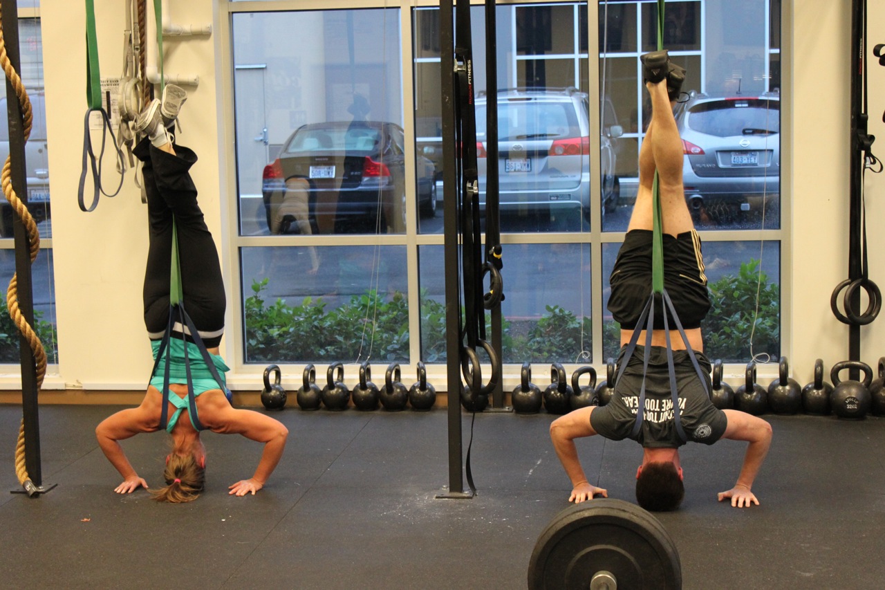 Resultado de imagen de assisted handstand push up with bands